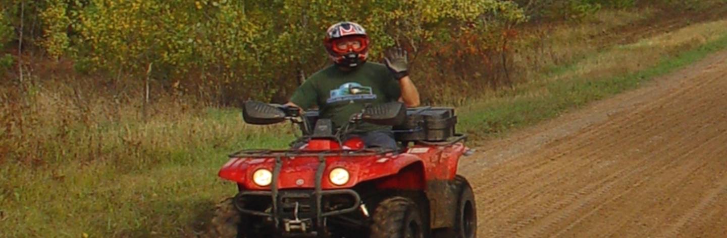 An ATV rider enjoys one of Marinette&#39;s outdoor recreational trails.