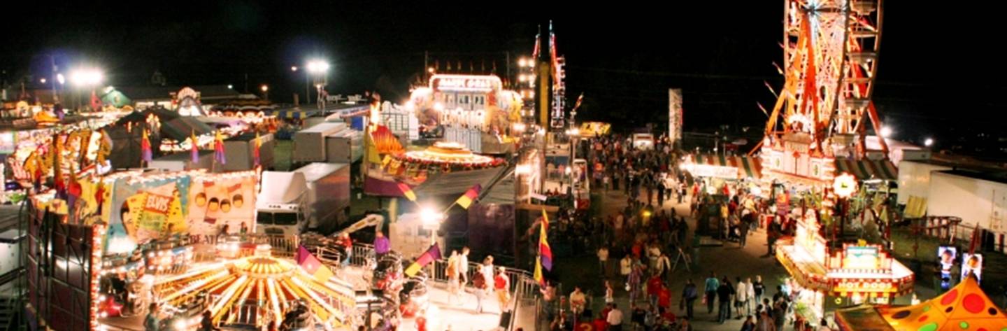 Bright carnival rides light up the night at the Walworth County Fair.