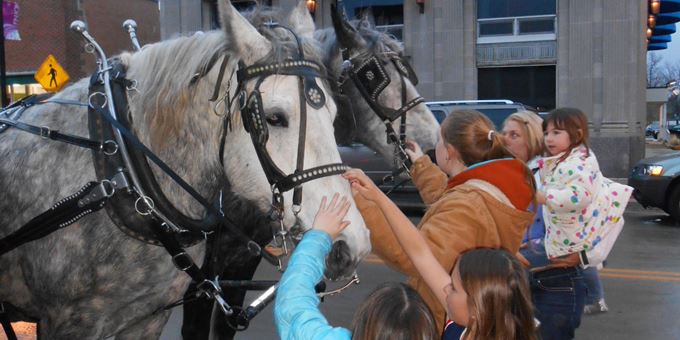 Free horse and buggy rides are a hit for the kids during Spring Gallery Night.