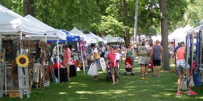 The trees of historic Swan Park provide nice shade for the Art in the Park Arts and Craft Fair