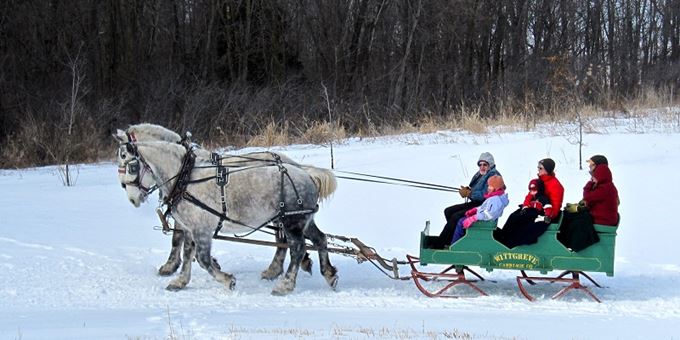 Wade House guests take a joyful sleigh ride through the snow.