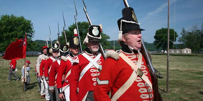 British War of 1812 re-enactors march in formation