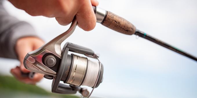 Close up of Hands on Fishing Pole While Fishing