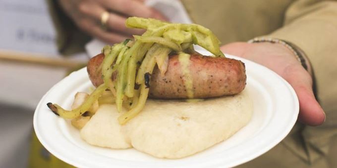 Longanisa sausage on a steam bun with cucumber slaw &amp; green garlic dressing