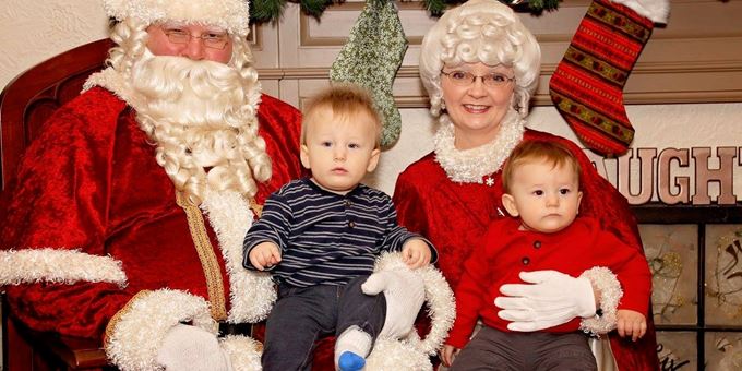 Santa &amp; Mrs. Claus with children on laps at Cambridge Classic Christmas