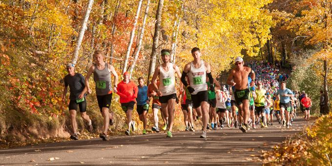 Runners enjoy the cool crisp autumn air and fall colors as they run along the trail during the 2013 CenturyLink WhistleStop Marathon.