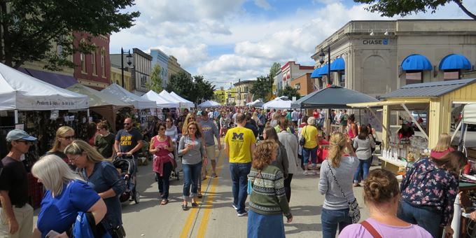 Vendors line downtown Oconomowoc&#39;s main street for Fall Fest shopping.