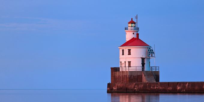 Superior Entry Lighthouse bathed in pink