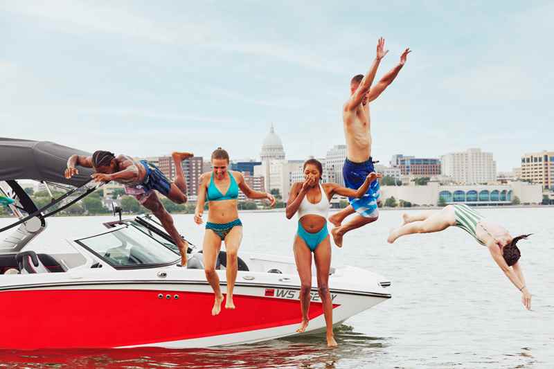 Friends Jump Off A Boat Into Lake Monona In Madison