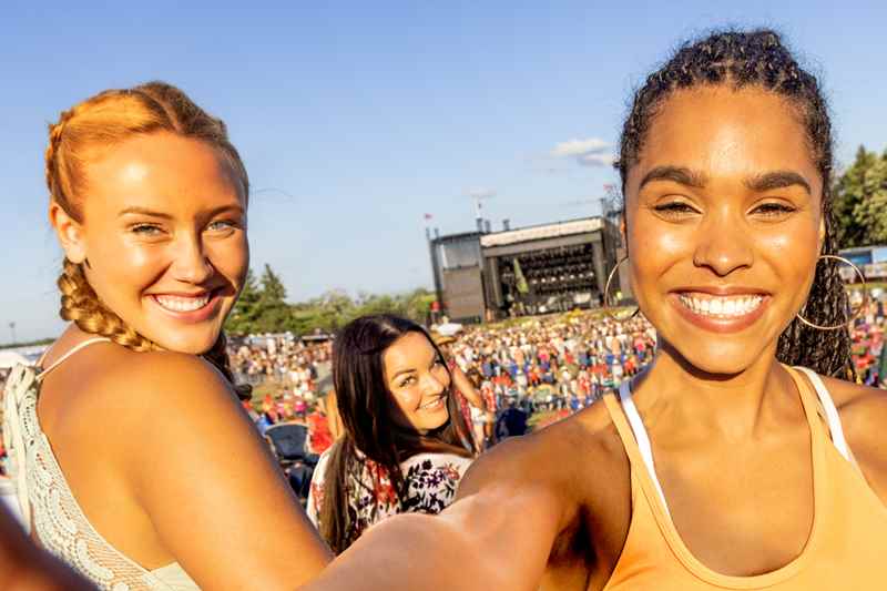 Girlfriends Enjoy Live Music At Country Thunder Music Festival In Twin Lakes