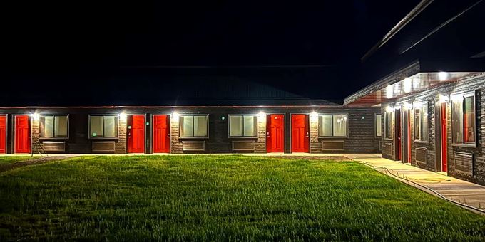 New Home Base lodging at Mt. Telemark lit up at night.