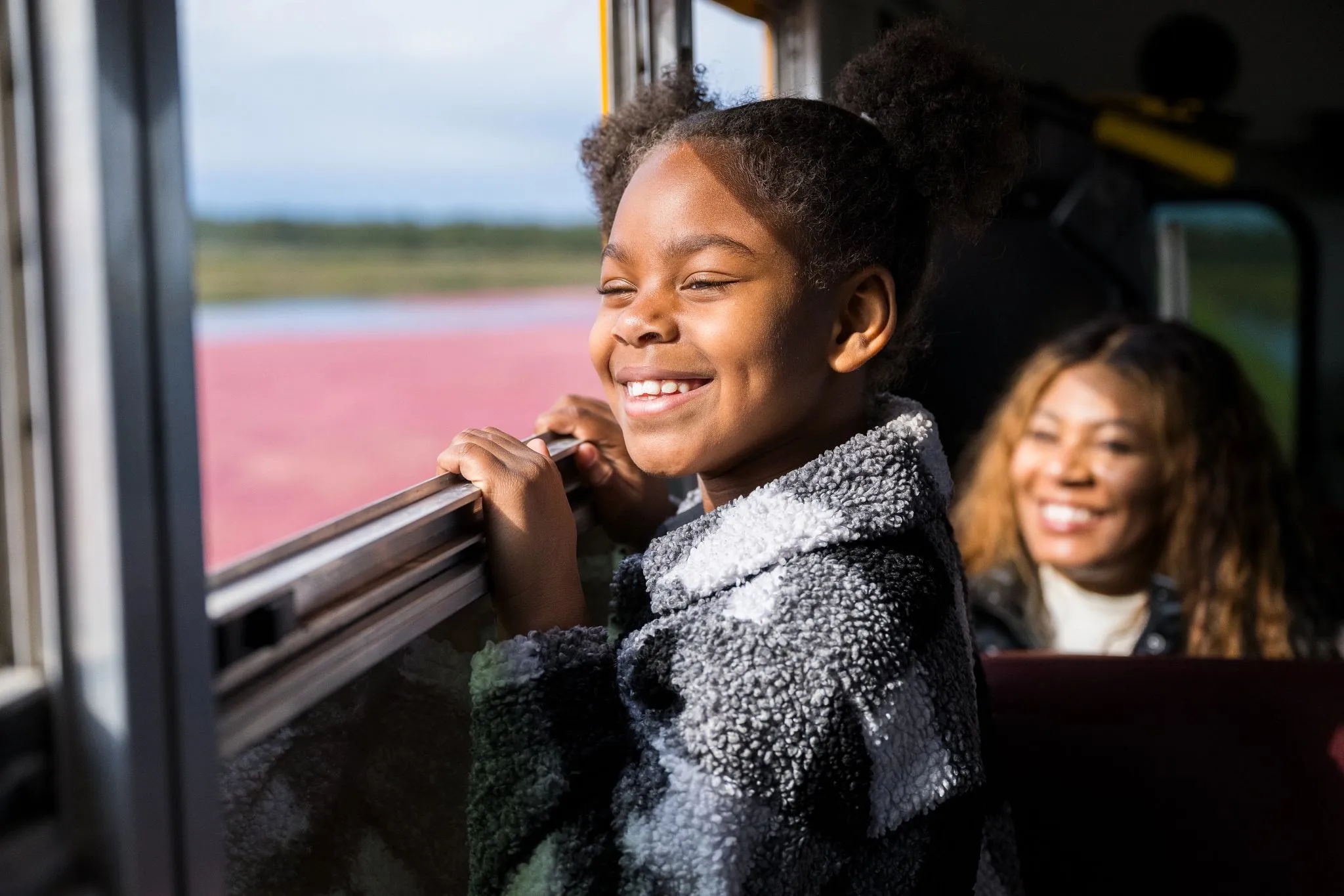 Girl looking at cranberry fields on tour in minocqua