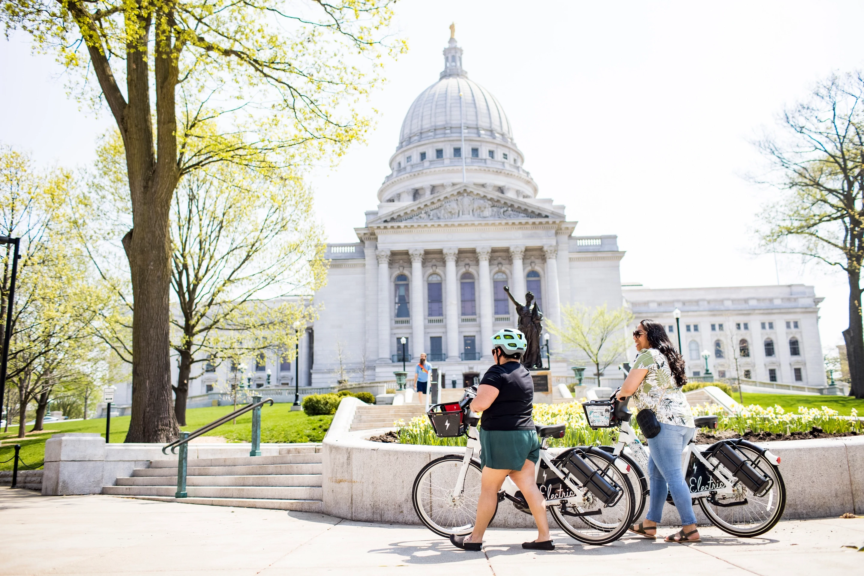 050 Women Ride Bicycles Near Capitol In Madison