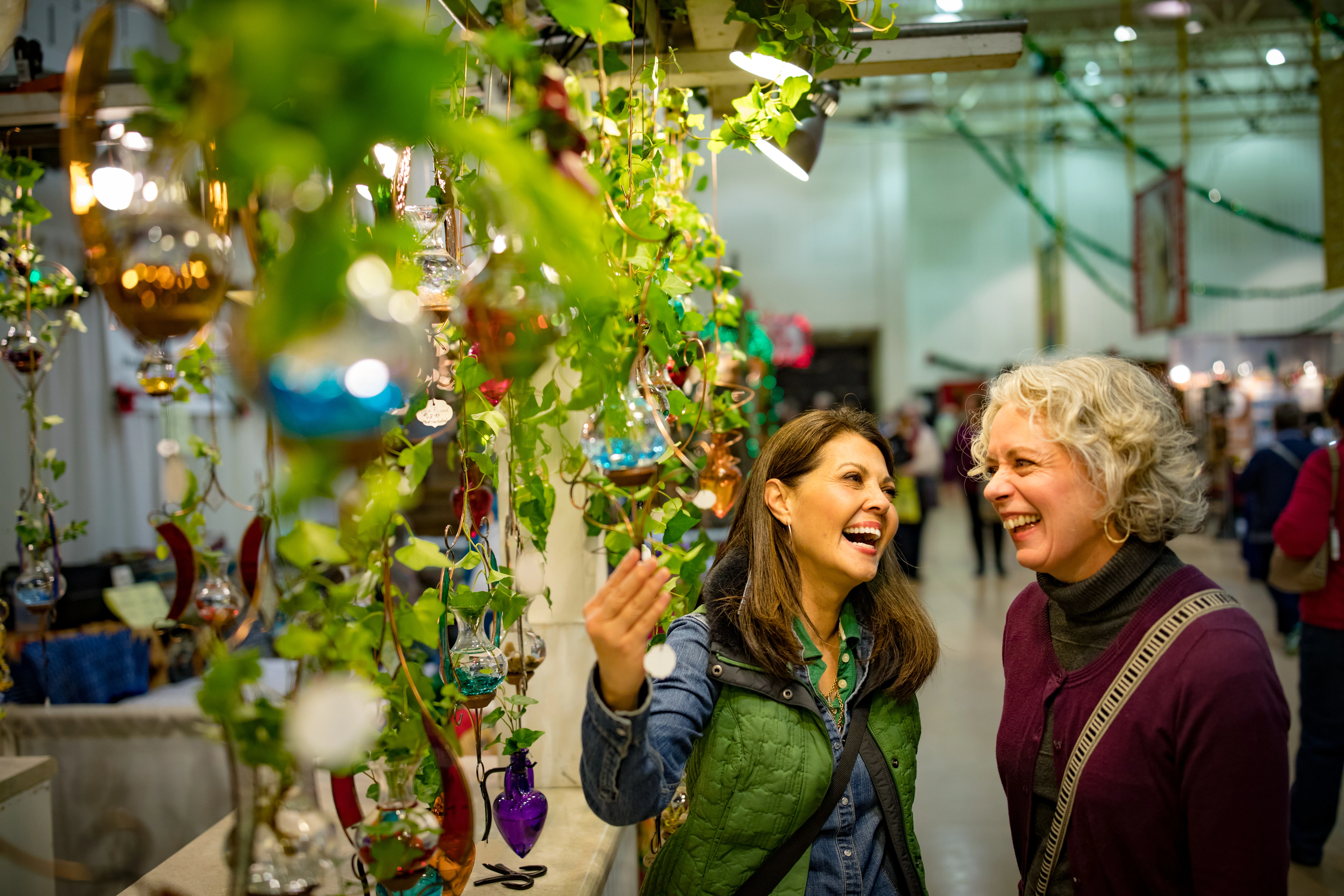 Woman Looking at Hanging Planters at La Crosse Holiday Fair 03