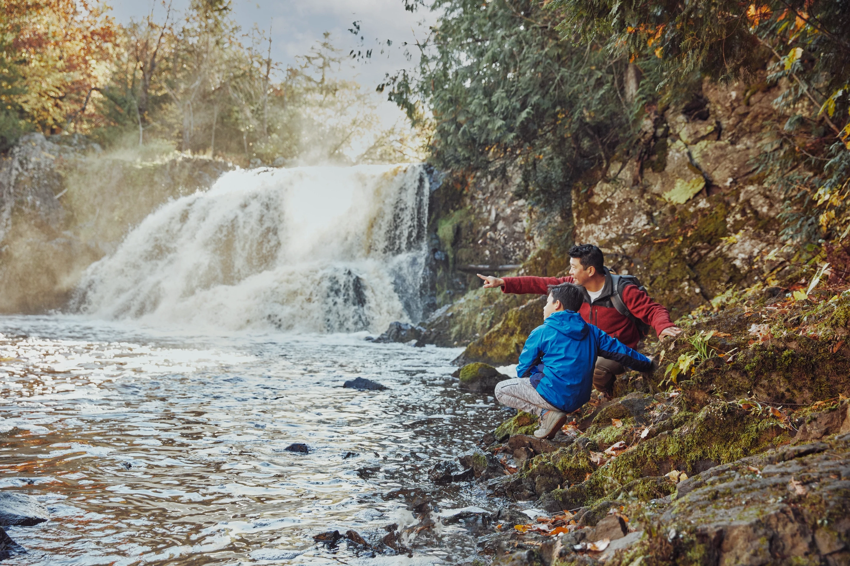 123 Father And Son Enjoy The View Of A Waterfall At Copper Falls State Park In Mellen