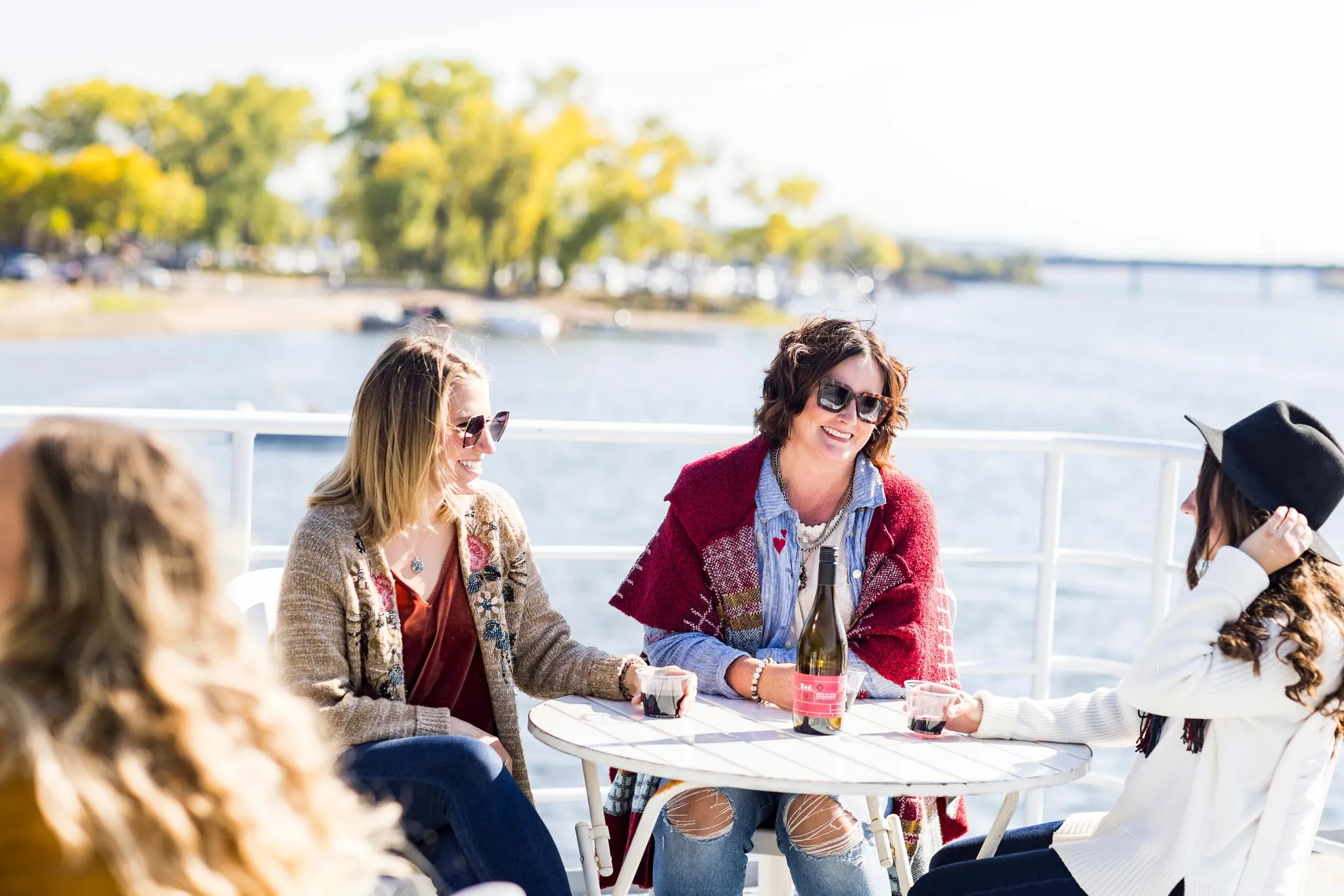Girlfriends enjoying wine on st. croix river cruise hudson Girlfriends enjoying wine on st. croix river cruise hudson