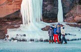 3ce54f92-beb7-4c47-8887-e6905f346150-friends-posing-frozen-waterfall-bayfield
