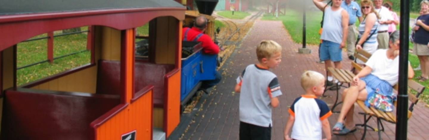 Visitors wait on the platform to board the train for their tour.
