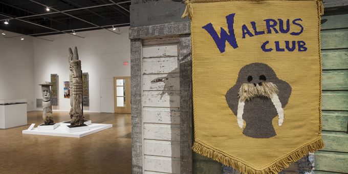 Mary Nohl and the Walrus Club installation view at the John Michael Kohler Arts Center, 2018. Banner: Maggie Sasso, The Walrus Club Banner, 2018; cotton and wood; 39 x 30 x 1/2 in.
