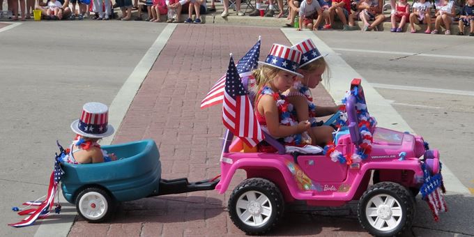 Young and old get into the patriotic spirit for the City of Oconomowoc&#39;s annual Fourth of July parade.