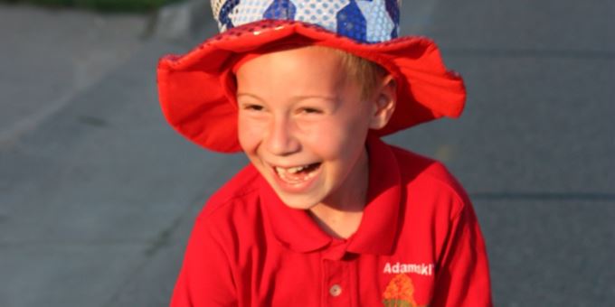 A youngster handing out candy at the 4th of July parade was all smiles! Photo by Antigo/Langlade Chamber of Commerce.