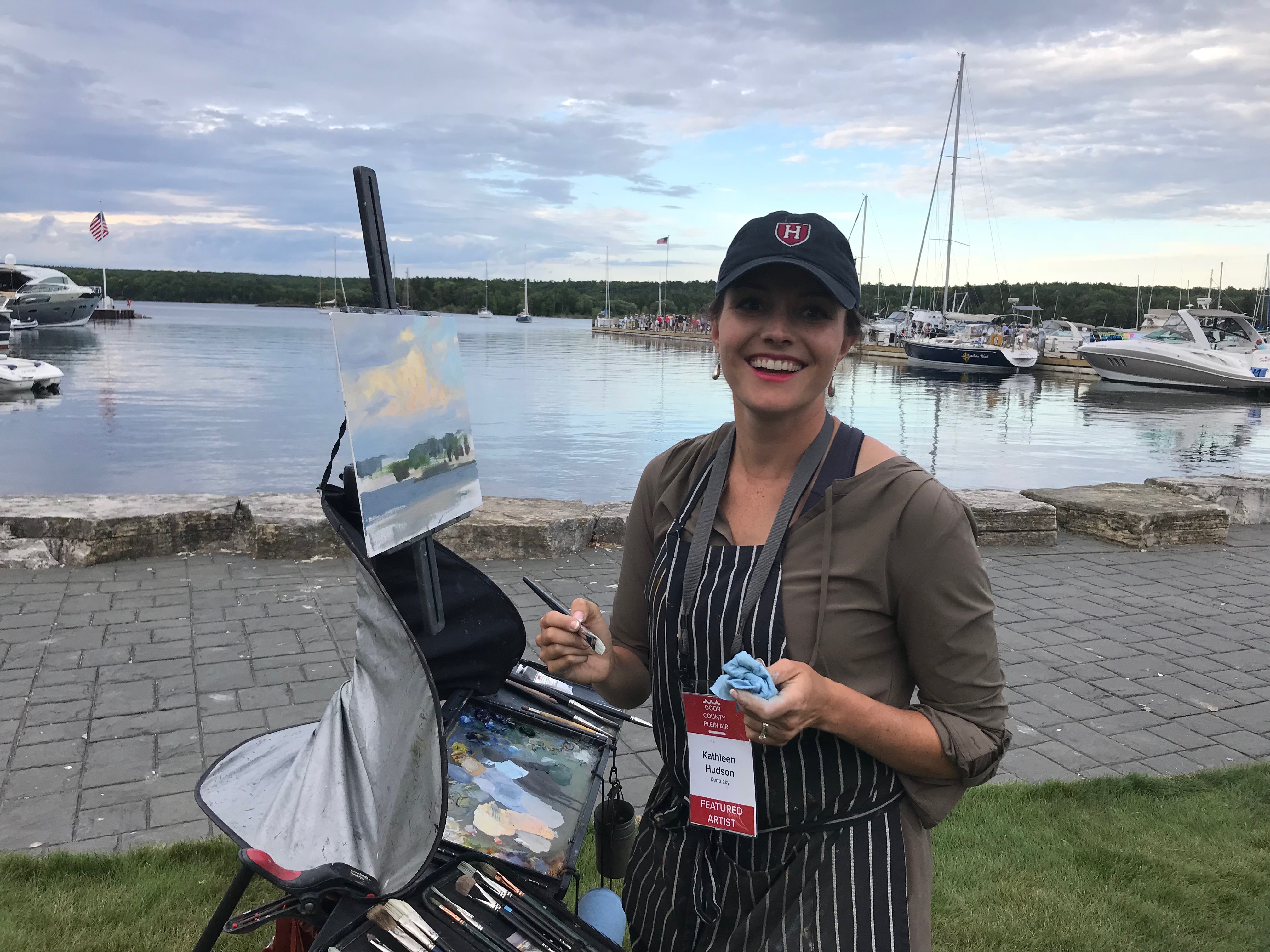 Artist Kathleen Hudson painting on location in Fish Creek