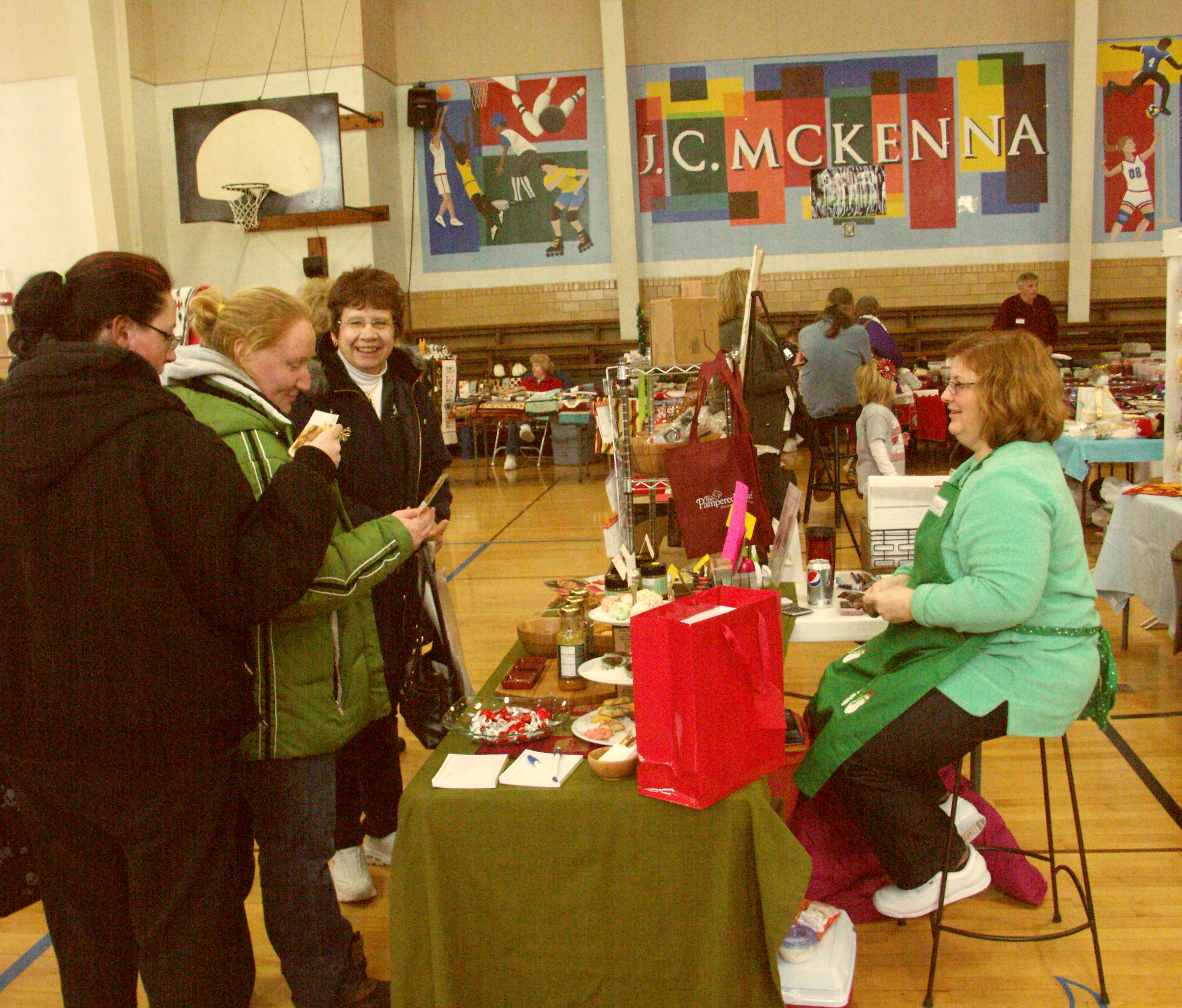For one Saturday in December, a local school is transformed into a holiday mall featuring delectable treats and wonderful gifts!  Photo by Kelly Gildner