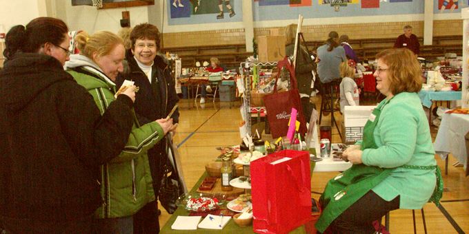 For one Saturday in December, a local school is transformed into a holiday mall featuring delectable treats and wonderful gifts!  Photo by Kelly Gildner