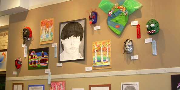 People browse student art which is featured from the high school during each Spring Gallery Night.
