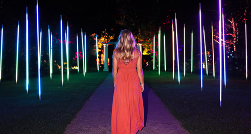 woman walking through light up area