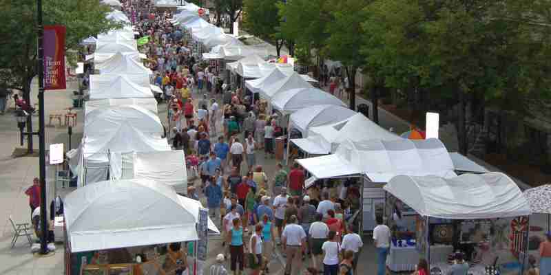 Shoppers browsing the booths at Artstreet.