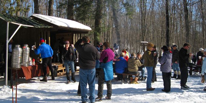 Ski and Snowshoe enthusiasts enjoying a bowl of chili at the Lauterman Shelter