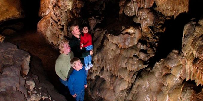 Family explores cave in the first section of the cave