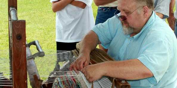 Weaving rugs at the Lost Arts Fest