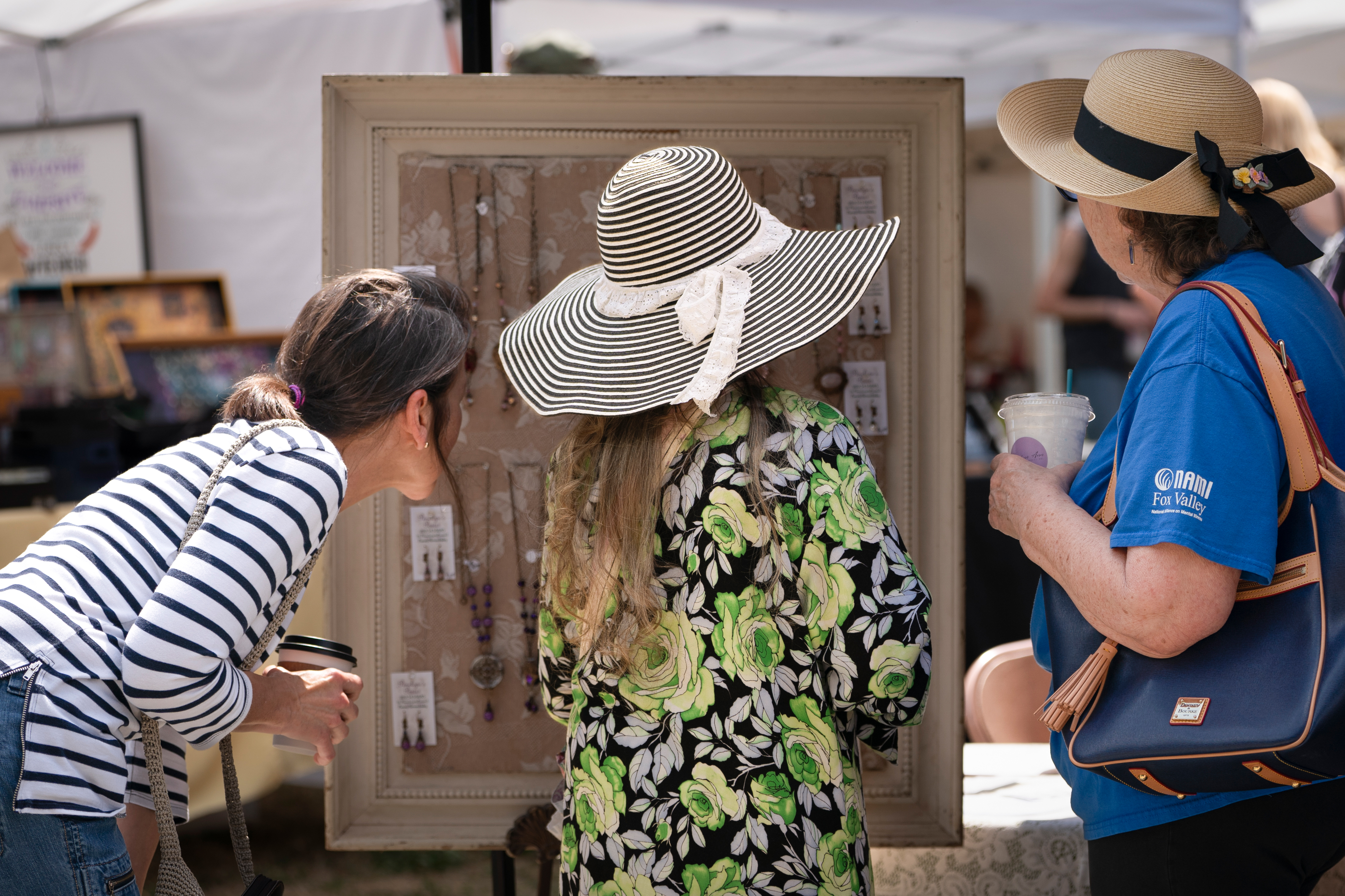 People view jewelry at Faire on the Green