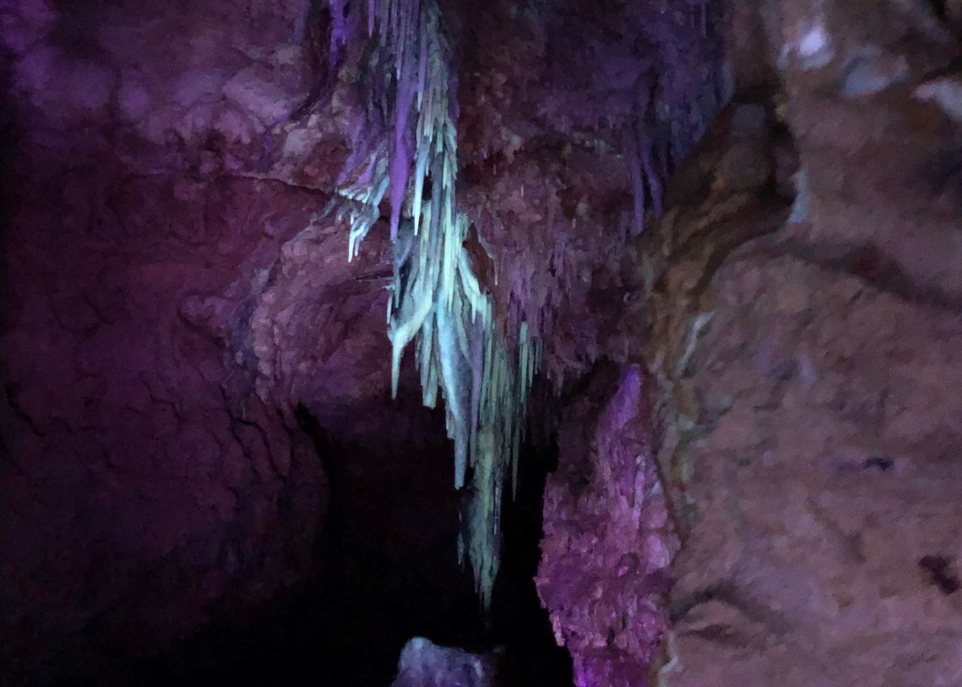Formations glow under UV light in Cave of the Mounds