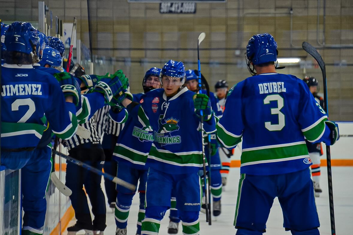 Hockey players after scoring.