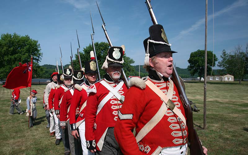 British War of 1812 re-enactors march in formation