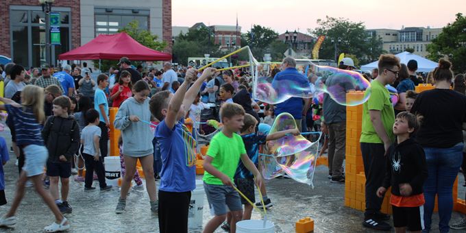 Kids playing with bubbles in kid zone