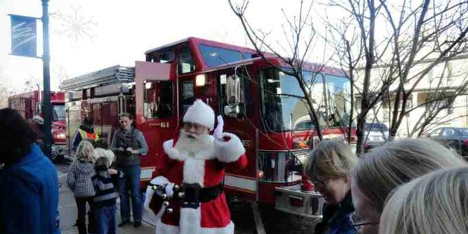 During Evansville&#39;s Olde Fashioned Christmas, Santa makes a surprise visit.  He arrives by local firetruck to the delight of kids of all ages.