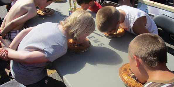 Pie in your face - Kids having a blast filling their stomachs and making a mess!