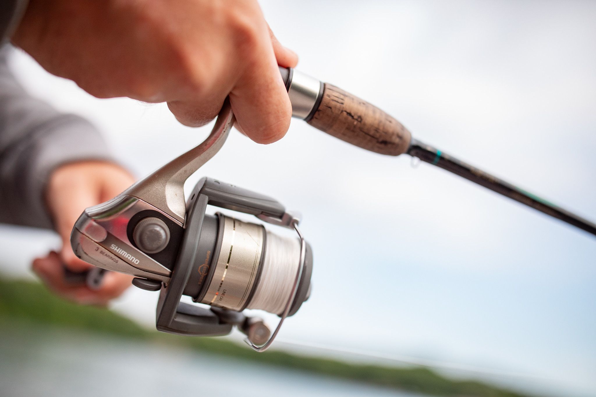 Close up of Hands on Fishing Pole While Fishing