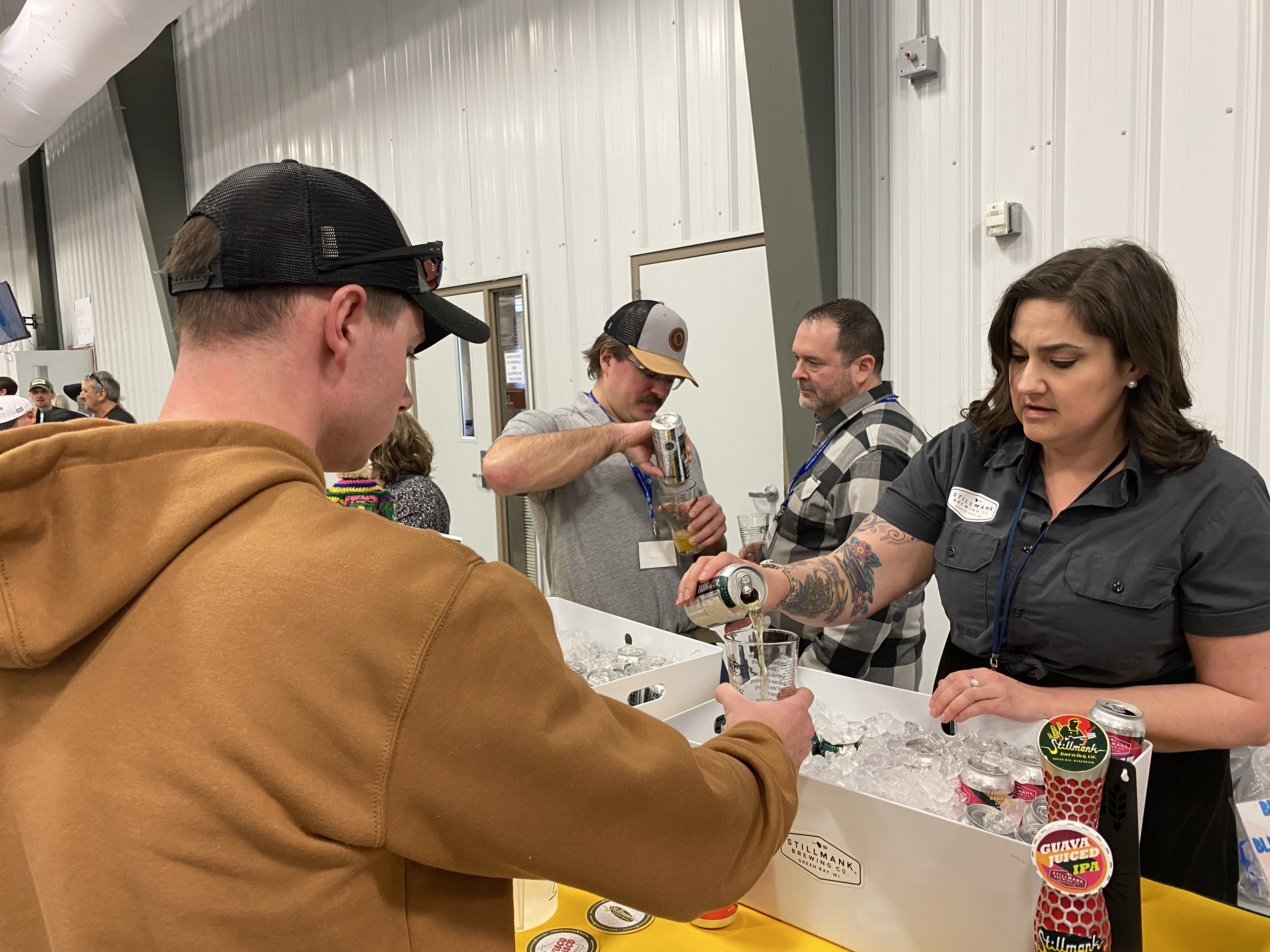 man getting beer sample poured into glass