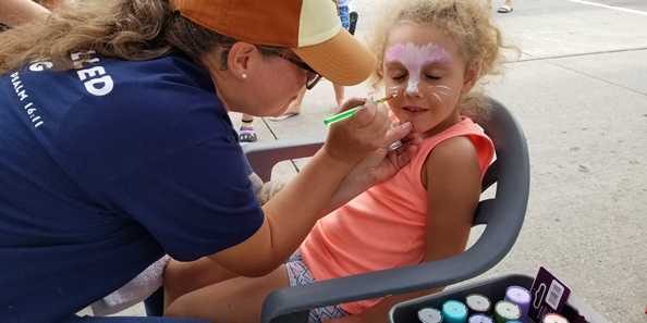 Getting your face painted.