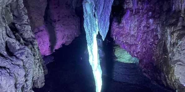 blacklights make cave formations glow in the darkness of Cave of the Mounds