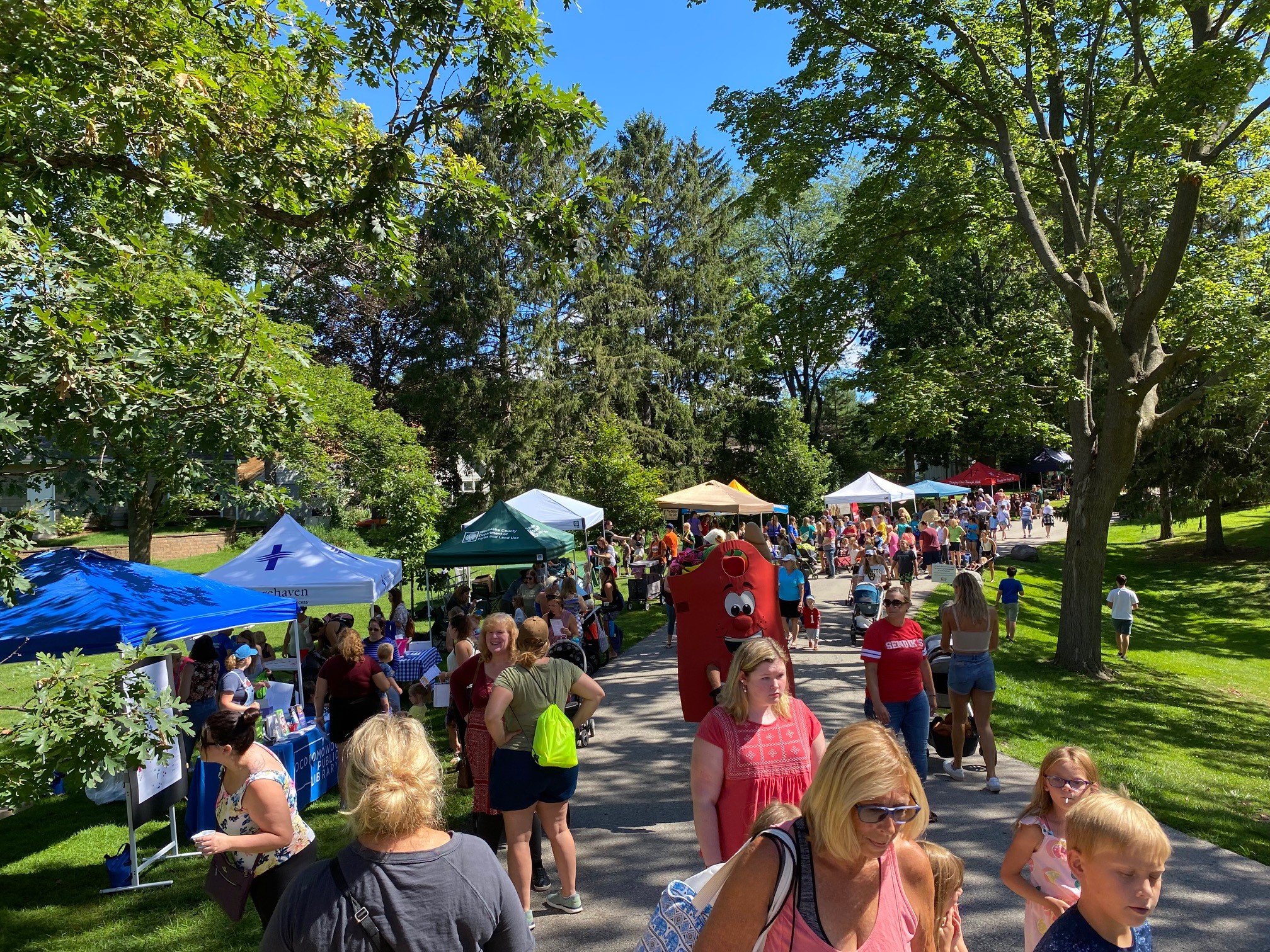 Local businesses and organizations fill the paths at Kids Fest with giveaways, games and information.