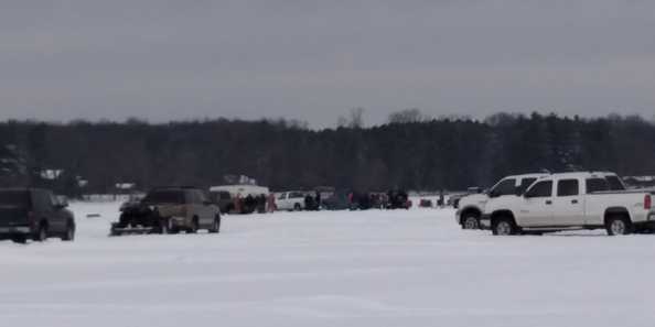 Vehicles &amp; ice shacks dot the ice all across Clam Lake in Siren.