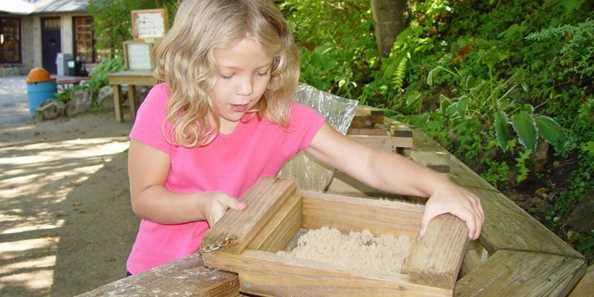 Young girl is finding her very own treasure at Cave of the Mounds Gemstone Mining