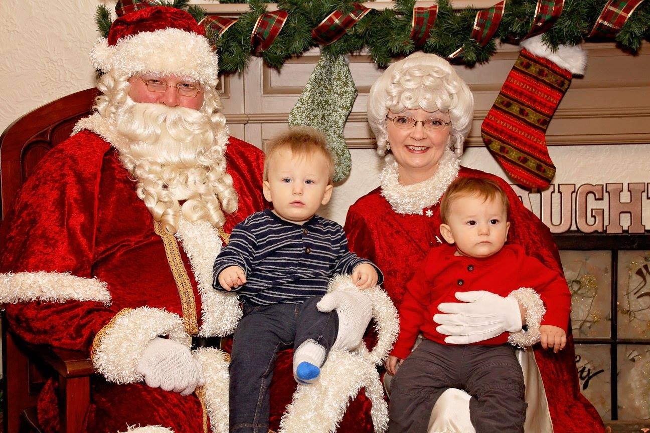 Santa &amp; Mrs. Claus with children on laps at Cambridge Classic Christmas