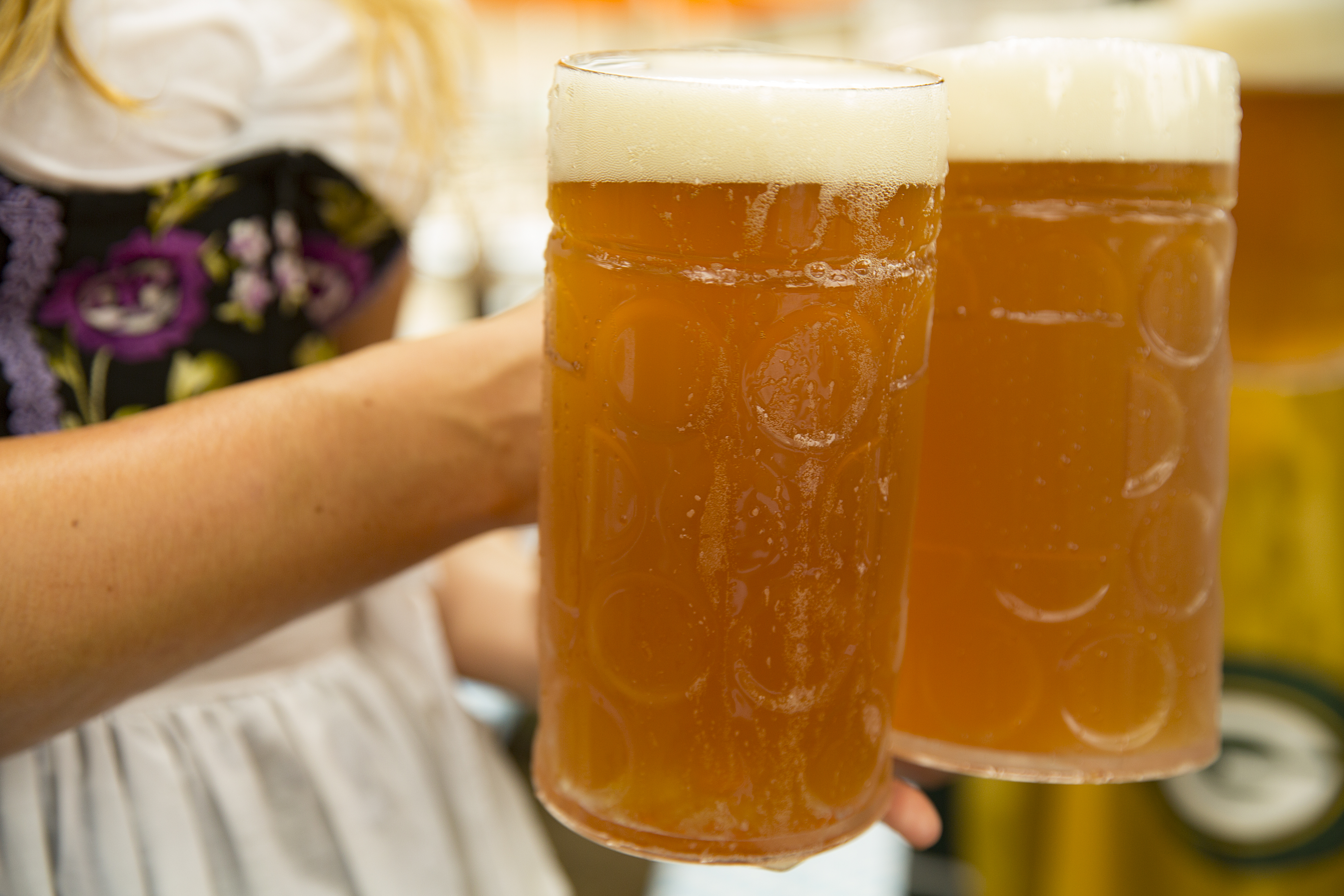 Hands holding large beers